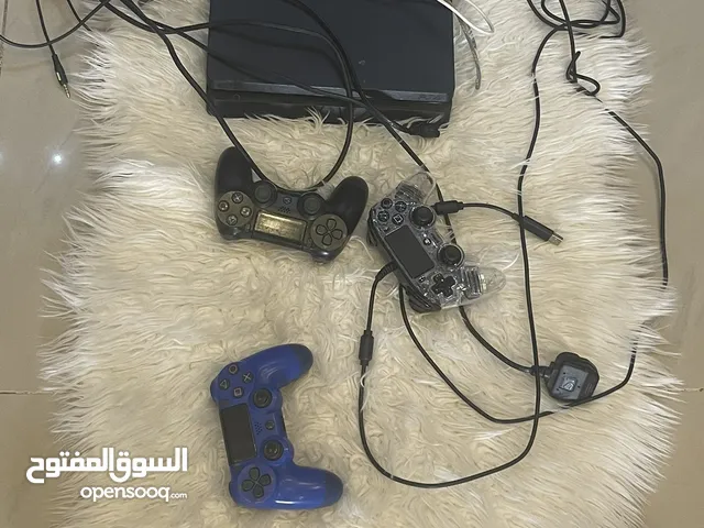 Playstation 4 with 3 controllers and one microphone