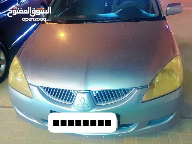 For sale or exchange: Mitsubishi Lancer GLX, 2004 model. Change something, ok. Needs passing and ins