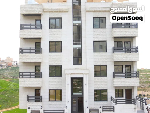 شقة ارضية مع ترس في ابو علندا قرب دوار البنزين