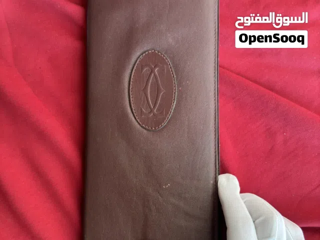 بوك - محفظة بطاقات كبيرة كارتير - كارتييه اصلية نادرة ...جلد طبيعي لون عنابي ... قطعة صعب تتكرر