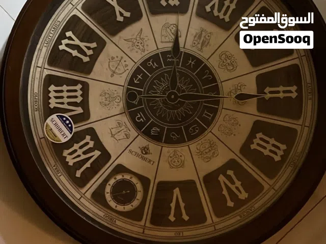 ساعة جدار خشبية