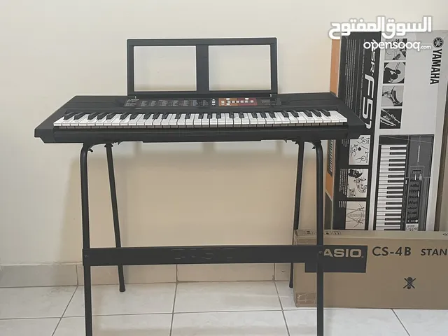 Yamaha PSR-F51 (61 keys) portable digital keyboard with a Casio CS-4B stand