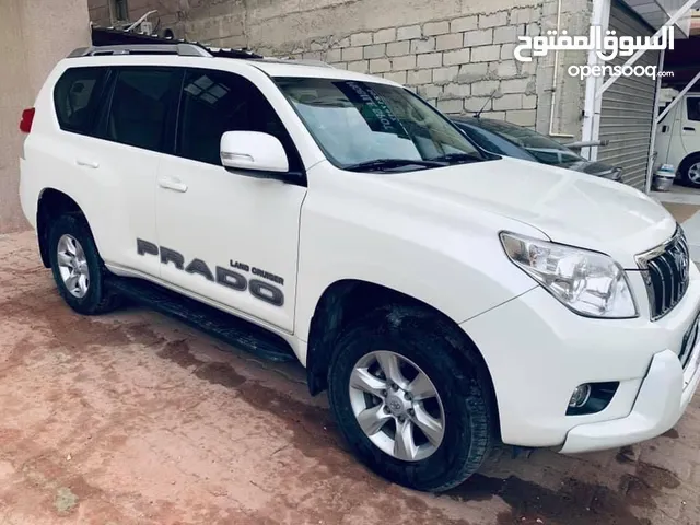 Toyota Prado 2011  TXL  6 Cylinder full Options. With son-roof white color.