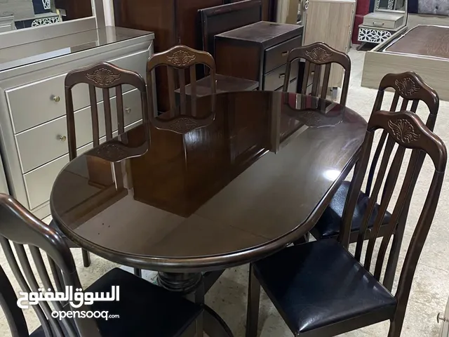 طاوله سفره 6 كراسي بحاله ممتازه خشب صولد كامل كراسي تنجيد لون اسود