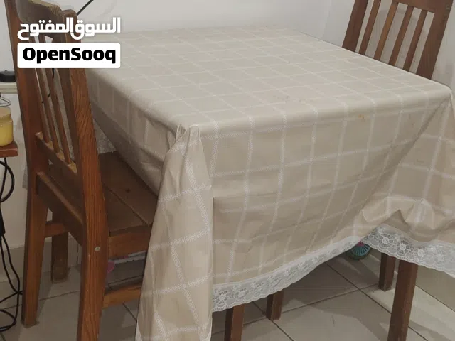 Square wooden table with chairs