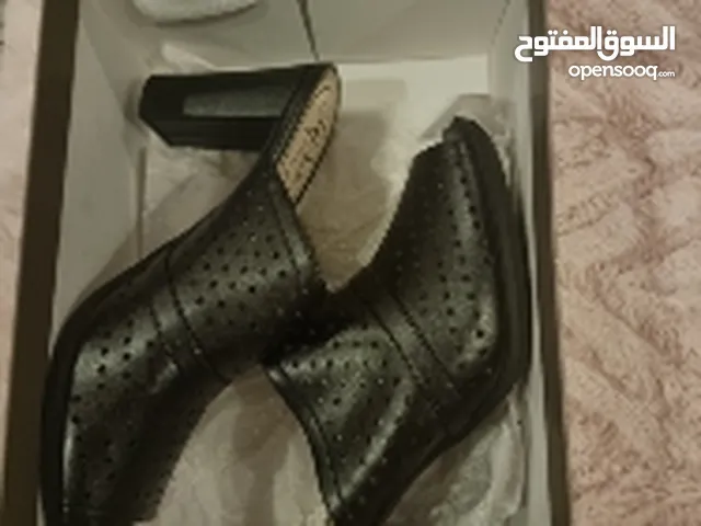 Black With Heels in Manama