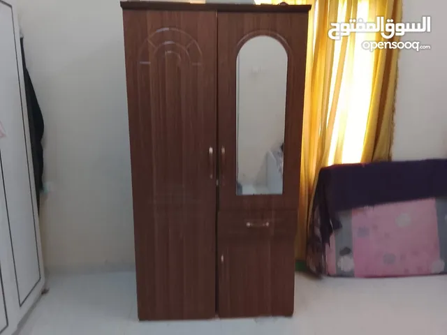 Used wardrobe and wooden cart