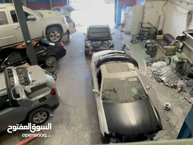 كراج ميكانيكي كهرباء سمكرة صبغ صناعية أربعة
