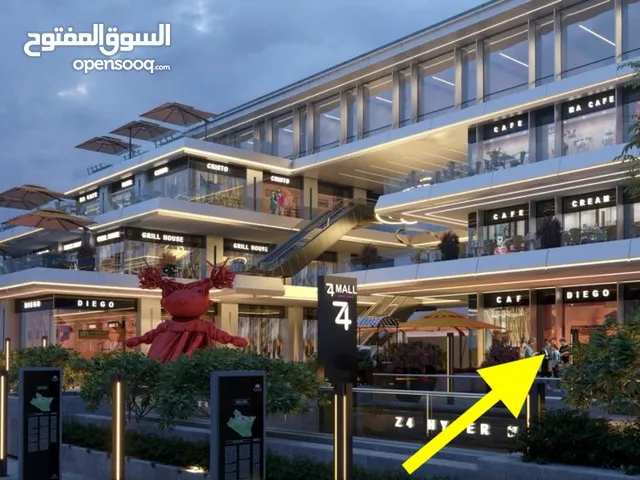 انا المالك - اقوي لوكيشن وارخص محل دور ارضي مع مساحة خارجيه في مول z4 زايد