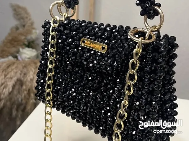 شنطة يدوية أنيقة باللؤلؤ تصميم مميز وفخم