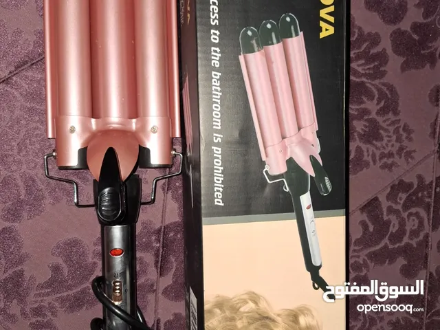 Nova NHC-928 three-barrel hair waver or curling iron. This type of hair tool is used to create "S" s