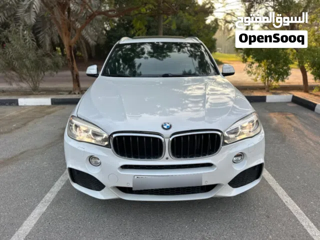 BMW X5, six-cylinder, full option, projector headlights, in showroom condition