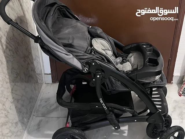 عرباية أطفال من مذركير وكرسي جونيورز للسيارات kd Mother care stroller and Juniors car seat.