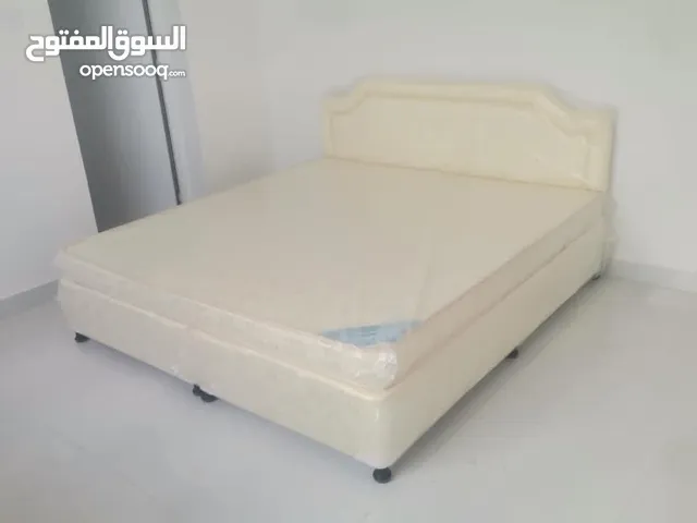 Double bed with mattress, two pillows and single mattress