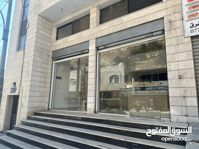 محلان تجاريان للإيجار في السلط – موقع استراتيجي مع سدة إسمنتية