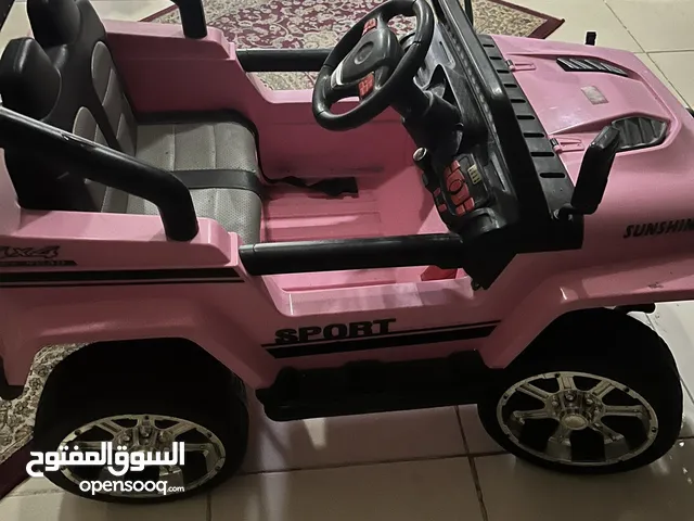 Pink car for kids to drive with charger