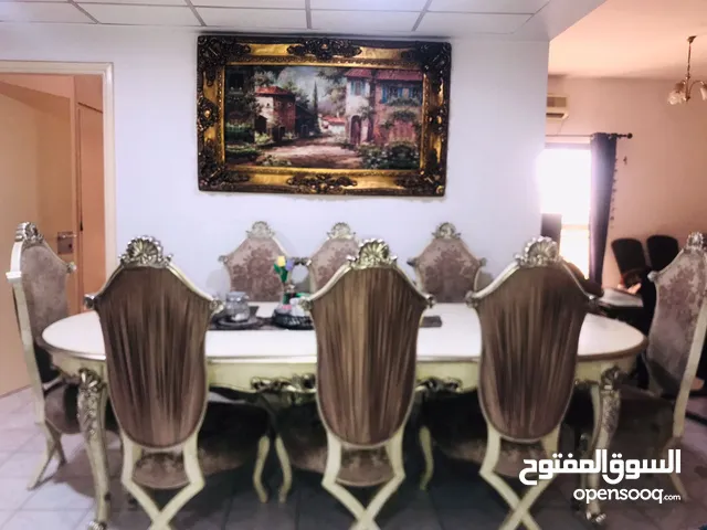 Luxurious Dining table for 8 and sofa for 5 with 2 paintings and a tea table