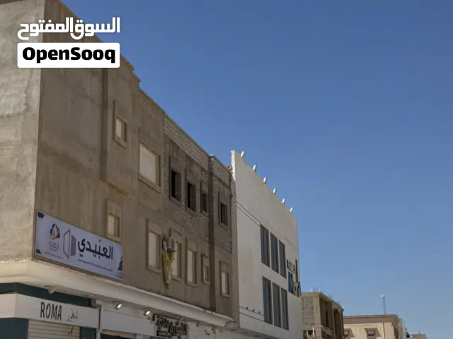 عقار تجاري في طريق النهر على ثلاث شوارع اربع شقق و خمس محلات
