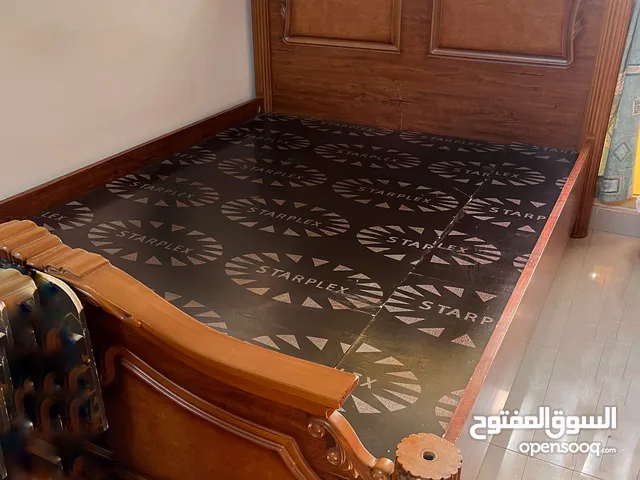 Wooden king size bed available