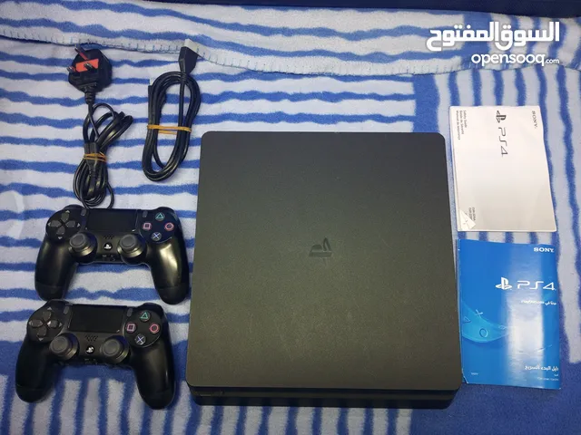 ..playstation 4 slim with two controllersبليستيشن فور سلم مع جهازين تحكم..