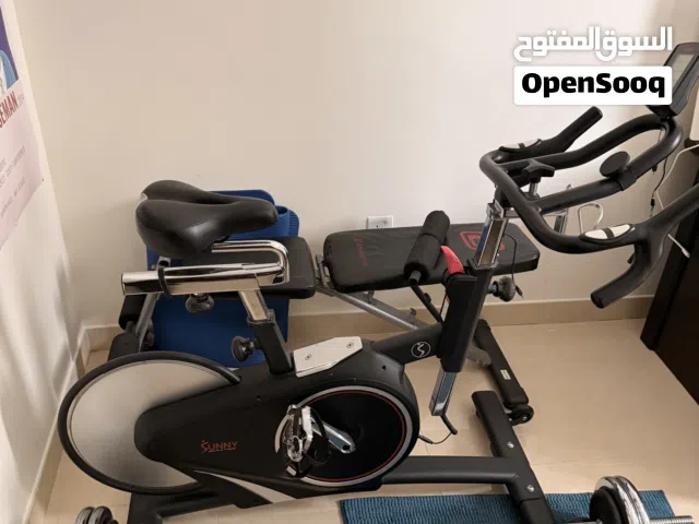 Used Indoor Exercise Bike with Free Weights and Bench - Good Condition