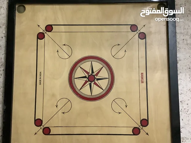 Carrom board with coins