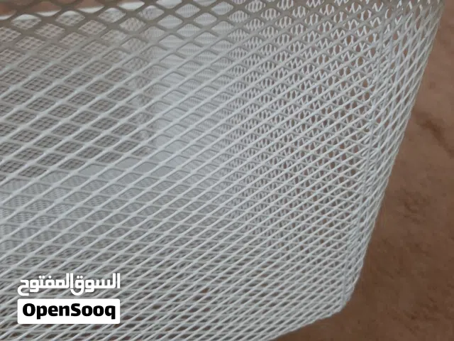 4 Pc iron net baskets and 2 dozen cloth hanging rods in excellent condition at throw away price.