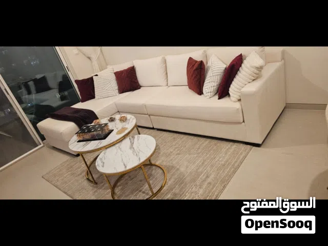 I'm selling an elegant velvet white corner sofa with coffee tables