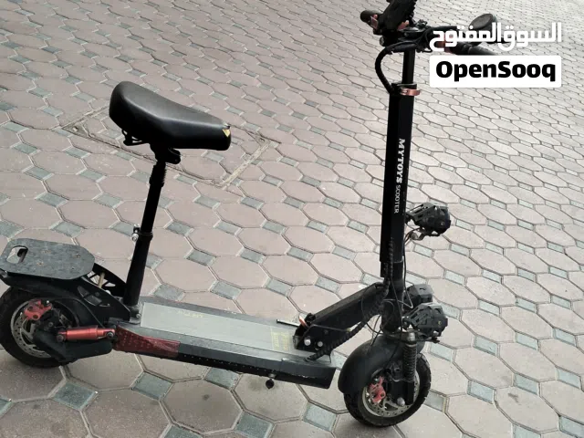 Electric scooter with a seat for sale   New, only very lightly used  - In perfect condition wi