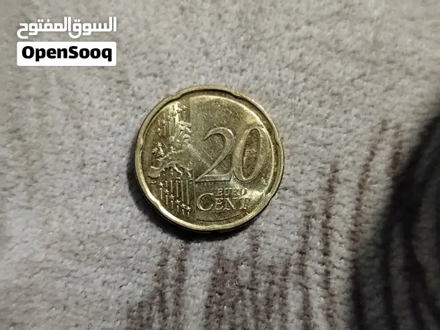 عملة معدنية من فئة 20 سنت يورو.يبدو أن العملة تعود لعام 2002،السعر. 200 الف عراقي