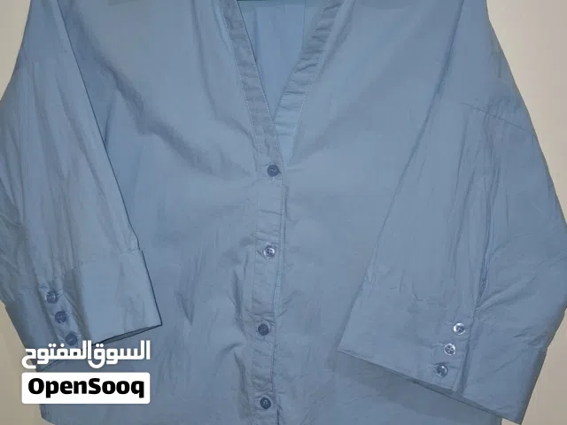 Chemise femme bleu ciel élégante – très bon état