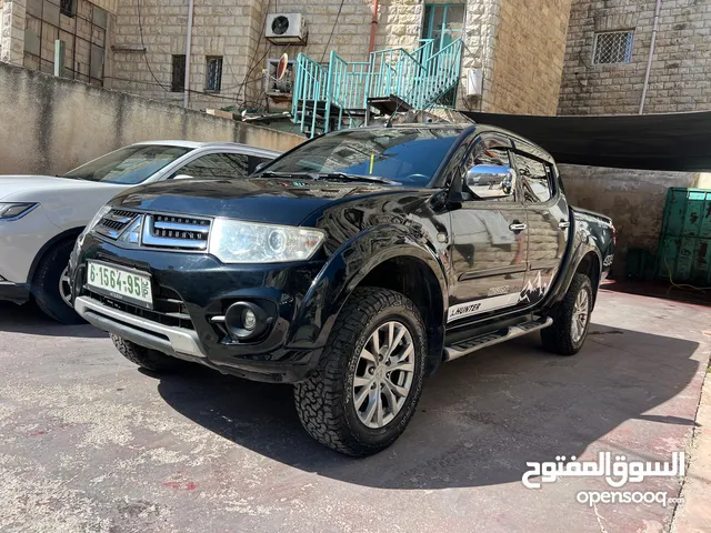 ميتسوبيشي هنتر 2015 اصل برايفت فحص ممتاز يد اولى اتومات 4x4 ترخيص 2014 رخصة وتام