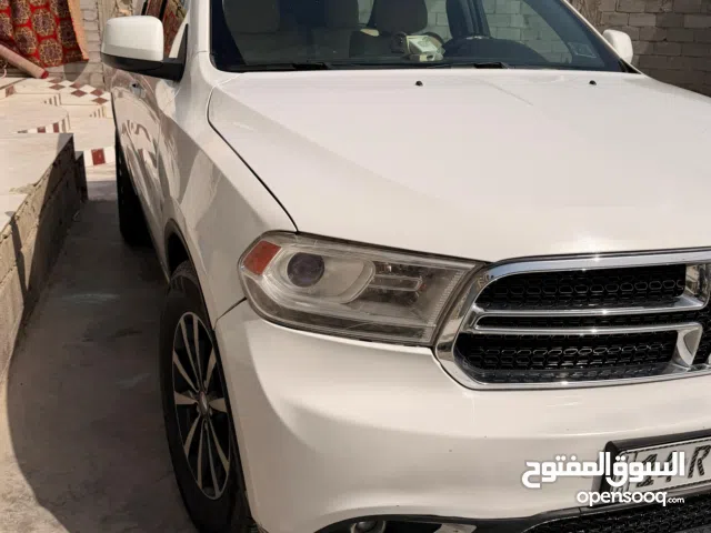 دوج دورانكو ابيض 2014 خليجي رقم بصره باسمي ماشيه 100 الف ميل مكفول البدي والمحرك والكير