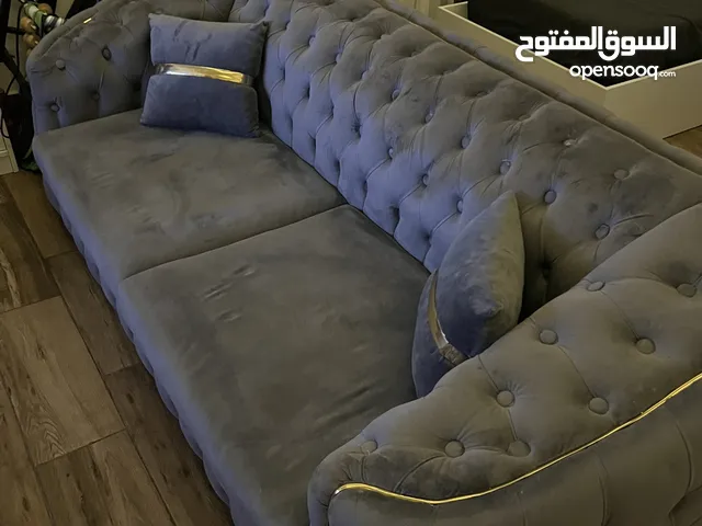 كنبة رمادية للبيع