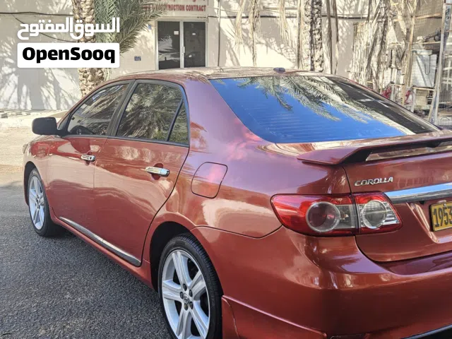 تويوتا كورولا SE 2013 برتقالي مستعملة مع ضمان وتأمين شامل