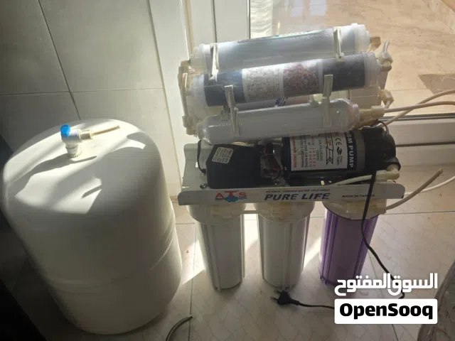 فلتر مياه سبع مراحل مستعمل بحالة ممتاز مع قارورة سحرية جديدة غير مستعملة