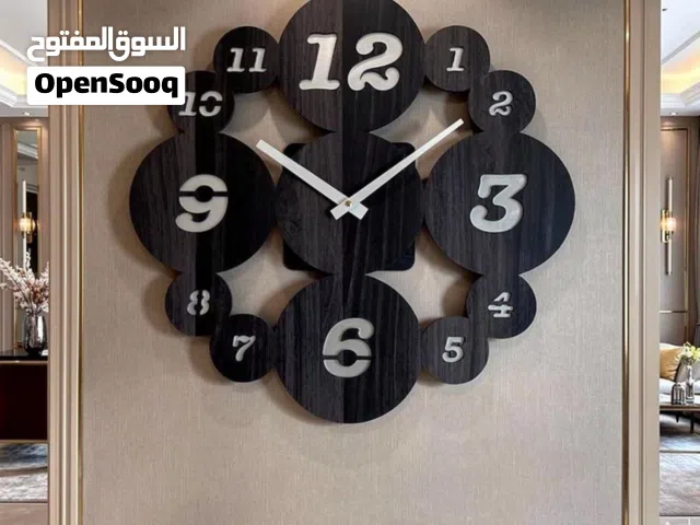 ساعة حائط مودرن خشبية سوداء – تصميم دائري ديكوري فاخر للجدران