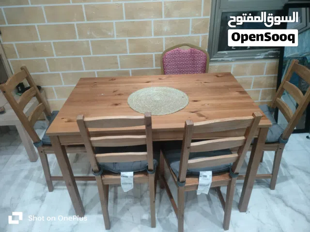 well maintained dining table with chair and extra cushion for 15kd