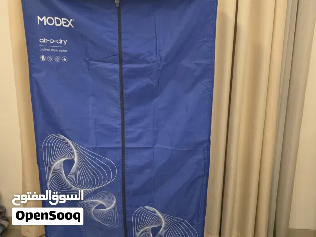 مجفف وكاوي ملابس من شركة modex