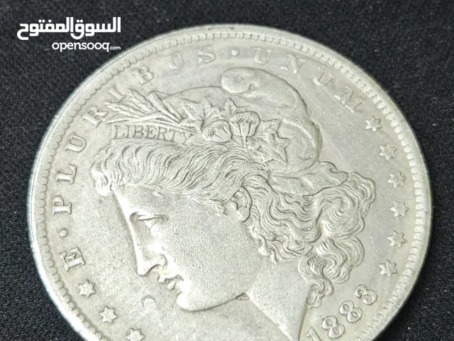 هذه العملة هي دولار مورغان (Morgan Dollar) أمريكي