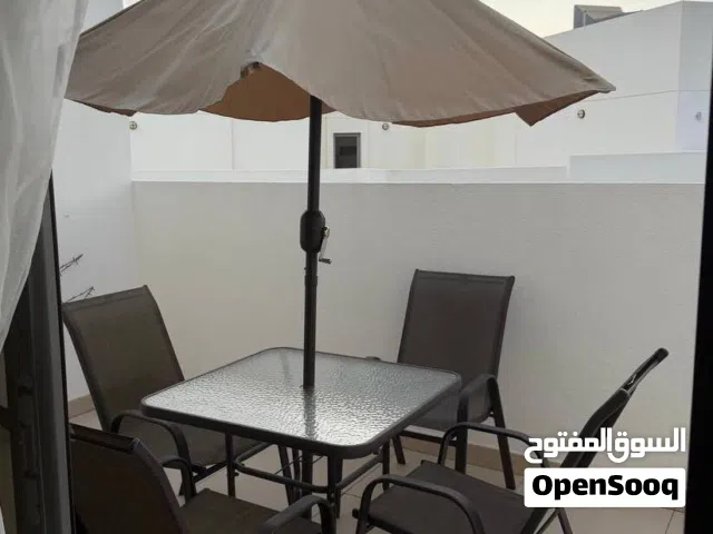 Table, 4 chairs, umbrella
