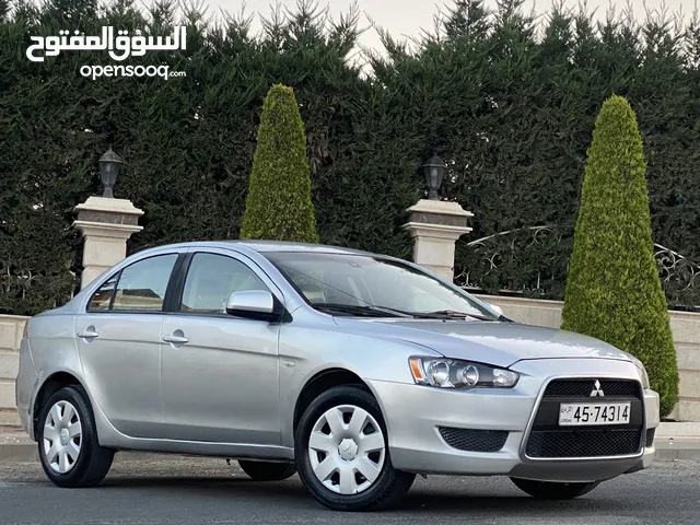 ‎ميتسوبيشي لانسر فراشة EX موديل 2014 لون سلفر ميتاليك بحالة ممتازة للبيع .