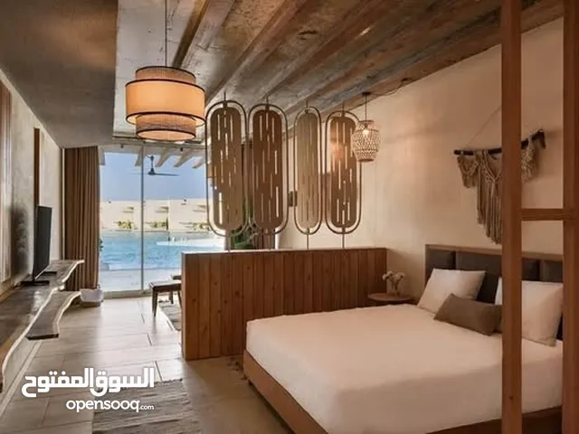 *شاليه ارضى بجاردن متشطب بالتكييفات و المطبخ في مالديف الساحل الشمالي ( قرية دايركشن وايت)