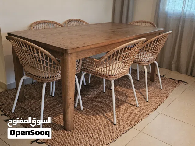 Homes R Us Solid Wood Dining Table + 6 IKEA Rattan ChairsBeautiful dining set featuring a solid wood