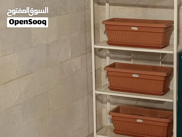 Outdoor shelf with three pots