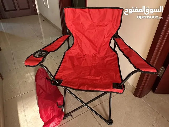 كرسي تخييم احمر جديد -"Red camping chair, new."