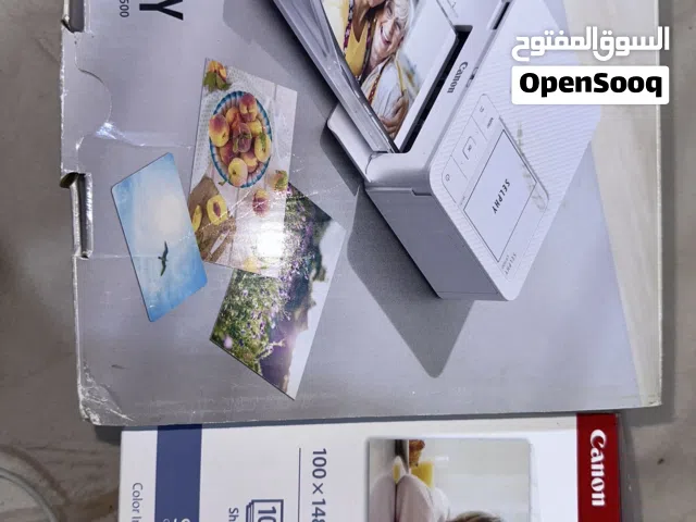طابعة سيلفي 1500 من كانون مع الورق