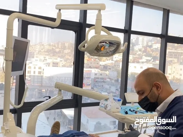 زراعة وتجميل الاسنان في جنين مركز د. اسامة عواد -برج الساعة ط4