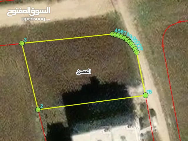 ارض 1032م - مرجم الاحيمر - الحصن - المنطقة الخلفة للهابي لاند - شارعين - بسعر 90000