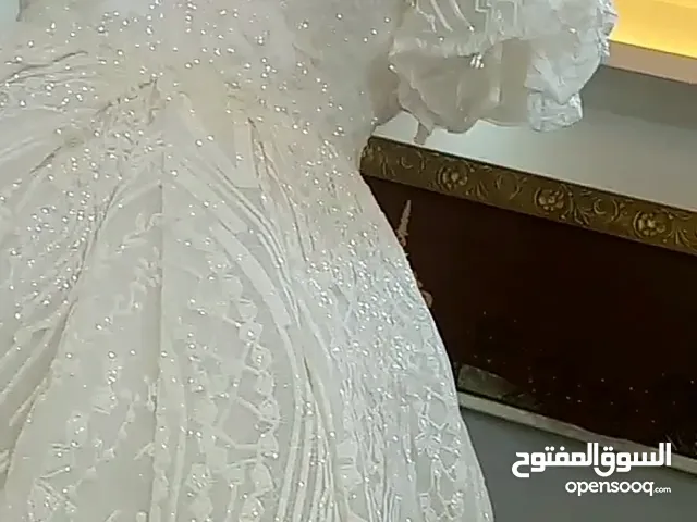 بدلة عروس ابيض